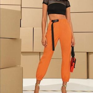 Neon orange cargo pants